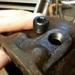 The new drain hole drilled and tapped by the frie